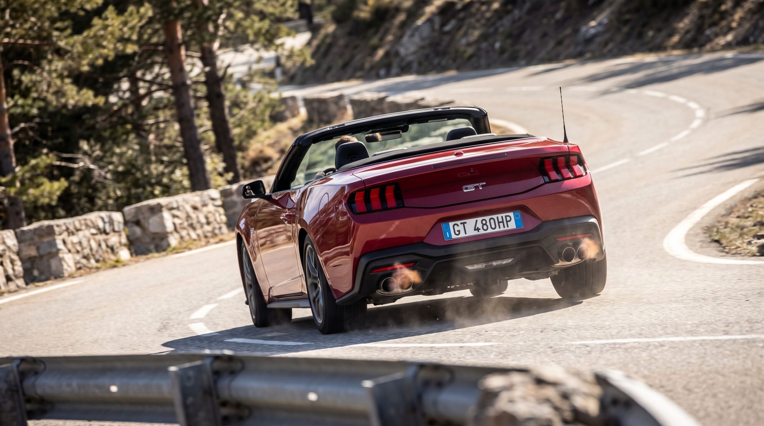 Mustang convertible taking corner scaled